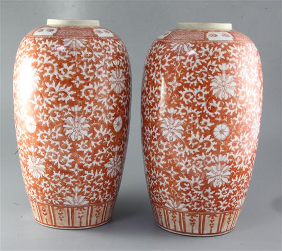 A pair of Chinese rouge-de-fer decorated ovoid vases, 19th century, height 38cm